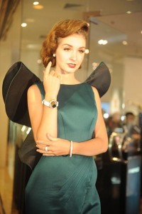 Model with Corum Feather watch in 18 Kt gold with dial made of a genuine Peacock feather and diamonds, Cadeaux Jewelry bangle Bremen, fully set with pavé diamonds and matching ring and earpieces. Venue: Grand Opening of Cadeaux Jewelry at Gaysorn, Bangkok, 15th July 2015.